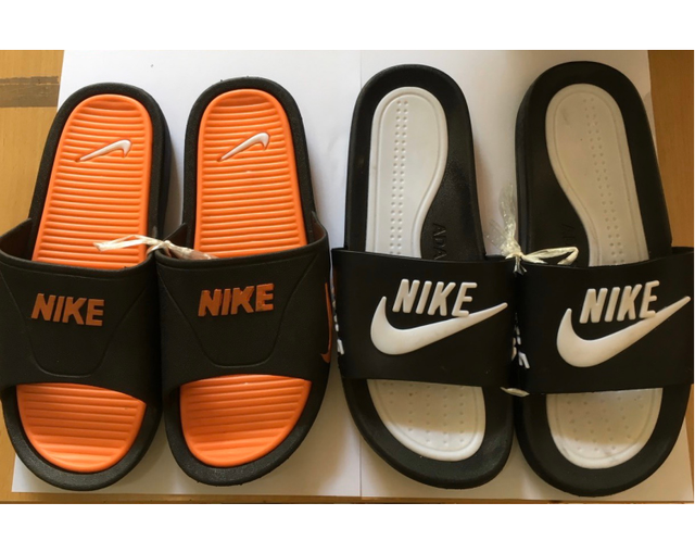Tạm giữ hàng loạt sản phẩm có dấu hiệu giả mạo nhãn hiệu ADIDAS, Nike - Ảnh 3.