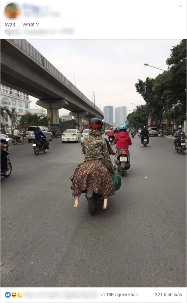 Người phụ nữ đi xe máy bịt kín như Ninja, nhưng chiếc áo mặc ngược cùng chiếc mũ bảo hiểm kì lạ mới khiến người đi đường choáng - Ảnh 2.