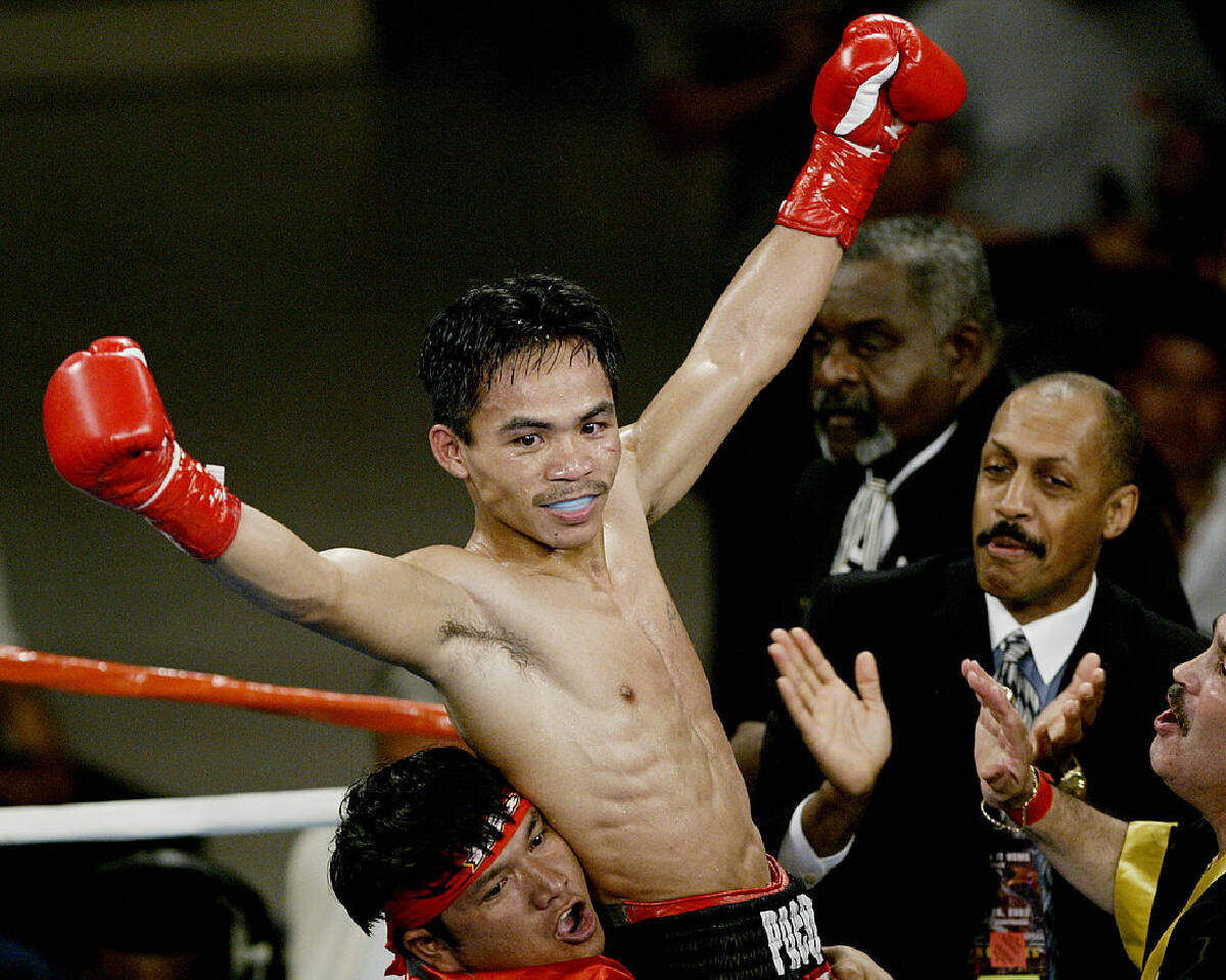 Sự nghiệp của huyền thoại Manny Pacquiao qua ảnh: Khoảnh khắc không thể quên của nhà vô địch thế giới ở 8 hạng cân - Ảnh 3.