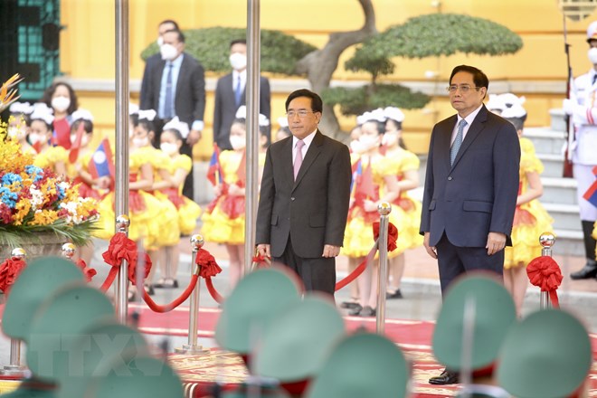 Thủ tướng Phạm Minh Chính chủ trì đón Thủ tướng Lào Phankham Viphavanh - Ảnh 5.