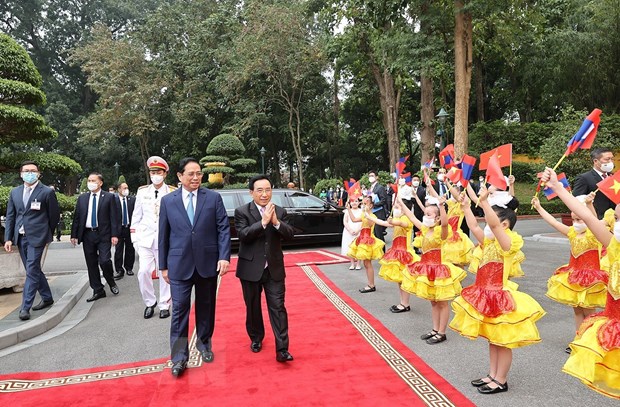 Thủ tướng Phạm Minh Chính chủ trì đón Thủ tướng Lào Phankham Viphavanh - Ảnh 1.