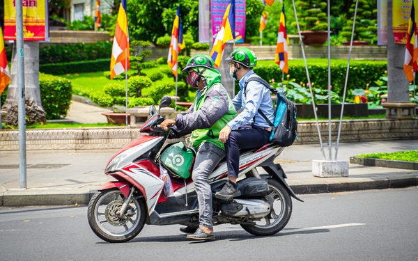 Bác tài Gojek và chuyện từ bỏ công việc lâu năm để chạy xe công nghệ - Ảnh 1.