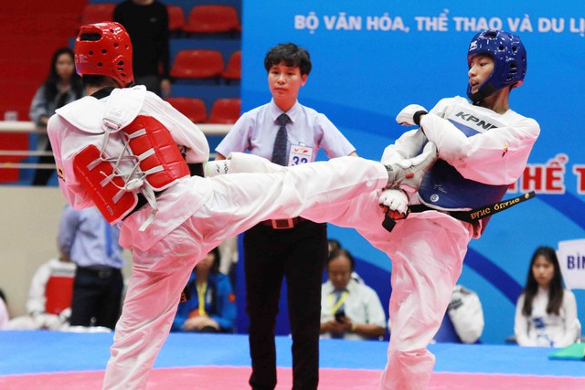 Võ sĩ 17 tuổi Phạm Đăng Quang giành Huy chương Vàng môn Taekwondo - Ảnh 1.