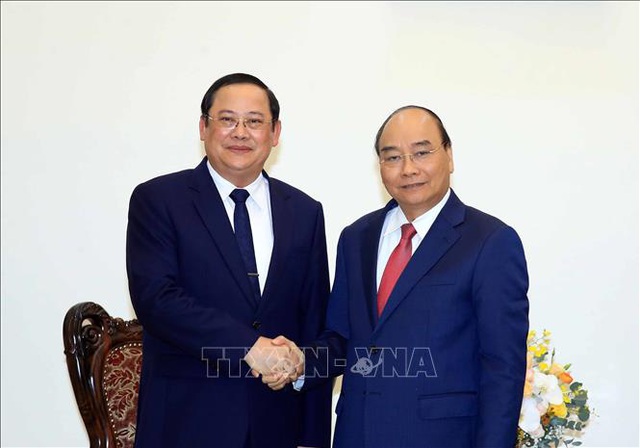  Thủ tướng Chính phủ tiếp Phó Thủ tướng, Bộ trưởng Lào - Ảnh 1.