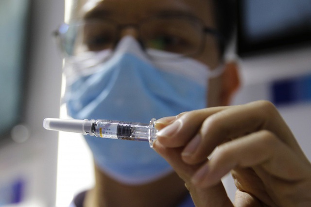 Trung Quốc bỏ ngỏ lựa chọn kế hoạch vaccine phòng Covid-19 toàn cầu của WHO - Ảnh 1.