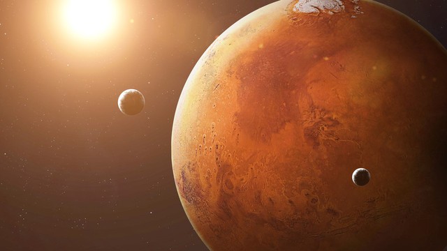 Các nhà khoa học phát hiện Sao Hỏa đang âm thầm 'xé toạc' Mặt trăng lớn nhất - Ảnh 1.