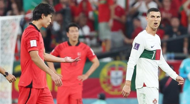 Ronaldo tranh cãi cùng tiền đạo Hàn Quốc ngay trên sân - Ảnh 1.