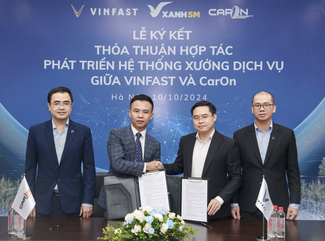 Vinfast hợp tác với CarOn mở chuỗi xưởng dịch vụ xe điện trên toàn quốc - Ảnh 1.