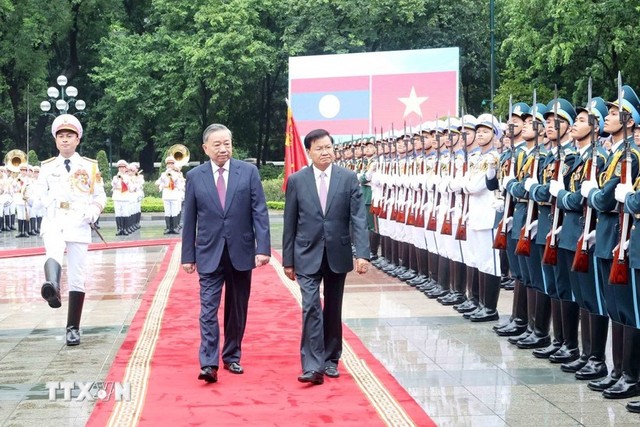 Những hoạt động đầu tiên của Tổng Bí thư, Chủ tịch nước Lào tại Việt Nam - Ảnh 1.