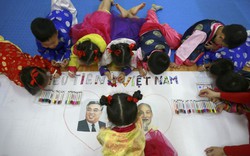 AP cận cảnh trẻ em Hà Nội hào hứng đón chờ Chủ tịch Triều Tiên Kim Jong-un